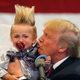 Donald Trump holds a Lil Trump he “pulled from the crowd” in New Orleans (AP Photo/Gerald Herbert)